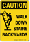 Caution Walk Down Stairs Backwards Sign